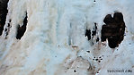 A little bit of glacier hangs along a shady wall in this high canyon in the Alaska Range. From Gunnysack Creek in Alaska.