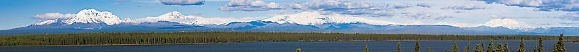 Here's a panorama of the Wrangell Mountains, viewed from a pullout overlooking Willow Lake along the Richardson Highway near Glennallen, Alaska.  A day this clear is rare, and the view is spectacular.  You have to view it full-sized to begin to appreciate what it's like scanning this range with binoculars. From Richardson Highway in Alaska.