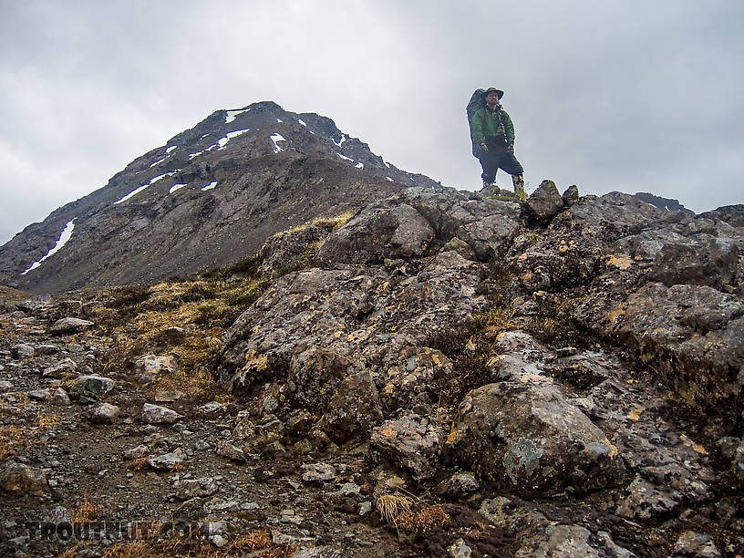 Standing atop the pass checking out the route down. From Clearwater Mountains in Alaska.