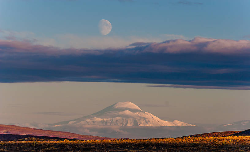 Moonrise over Mt Sanford. An unusually clear view of this mountain from 90 miles away on the Denali Highway From Denali Highway in Alaska.