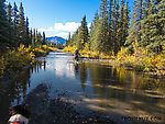 Crossing part of Windy Creek. Most of Windy Creek flows under Valdez Road through culverts, but in a couple places it just washes over the road when it's high. It was a bit tricky riding the bikes through the flowing water over some rough cobble and trying not to get wet. From Windy Creek in Alaska.