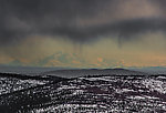 Denali from near Murphy Dome. I don't know what the peculiar bright light is shining near the top of the mountain on the right side. It was conspicuous like this for several minutes. I don't know what's up there that would reflect sunlight (or emit its own light) and look so much brighter than everything else from 150 miles away. From Murphy Dome in Alaska.