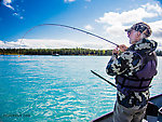 Dad playing a big fish From the Kenai River in Alaska.