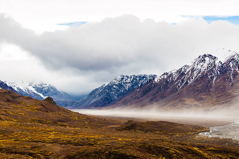 Dust storm up the glacial Toklat River From Denali National Park in Alaska.