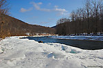 Deep snow melts away from a storied Catskill river as spring nears. From the Beaverkill River in New York.