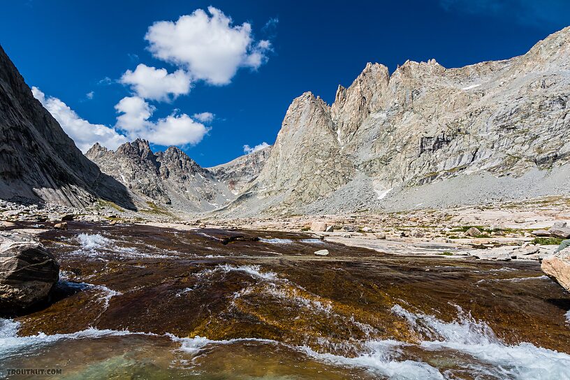 Waterfalls over smooth bedrock above Titcomb Lakes From Titcomb Basin in Wyoming.