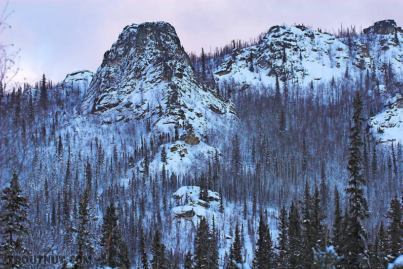 This rock formation overlooks a grayling stream on the central Alaskan road system. From the Chena River Valley in Alaska.