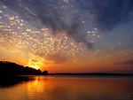 Here's a pretty sunset over a warmwater lake in the northwoods.  It may not be trout water, but I couldn't leave it off the site. From Grindstone Lake in Wisconsin.