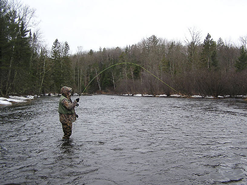 My dad plays the first brown trout he's ever caught on a fly. From the Namekagon River in Wisconsin.