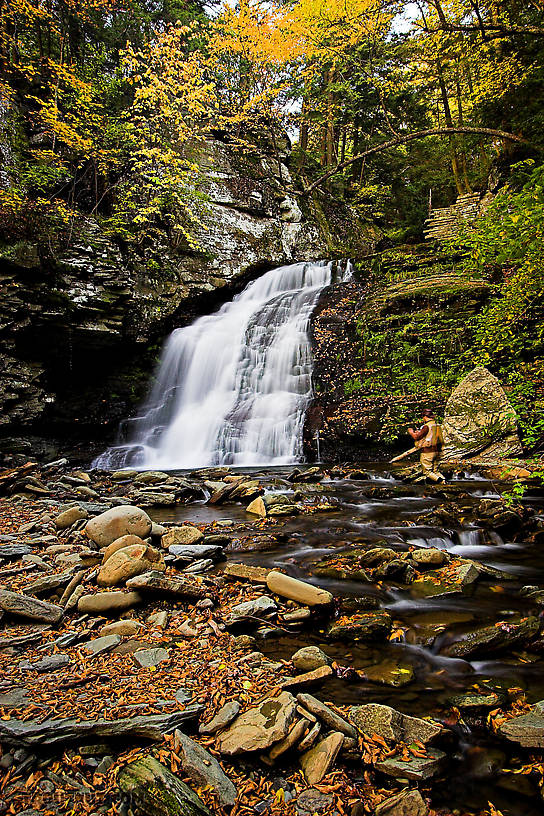 I kneel on a rock trying to catch brookies in a waterfall pool. From Mystery Creek # 89 in New York.