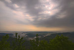 A trout stream valley covered in mist after a spring thunderstorm on a hot, humid day. From Penn's Creek in Pennsylvania.