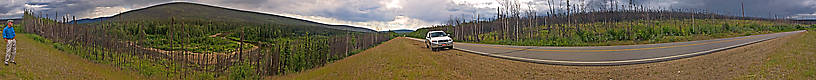 Here's the first of many new pictures of Alaska that I'll be putting online as soon as I get the chance. It's a panorama of my dad standing and looking across the valley of the river where we both caught our first arctic grayling an hour or so later.

You've got to see it full-size to appreciate it. From the Chatanika River in Alaska.