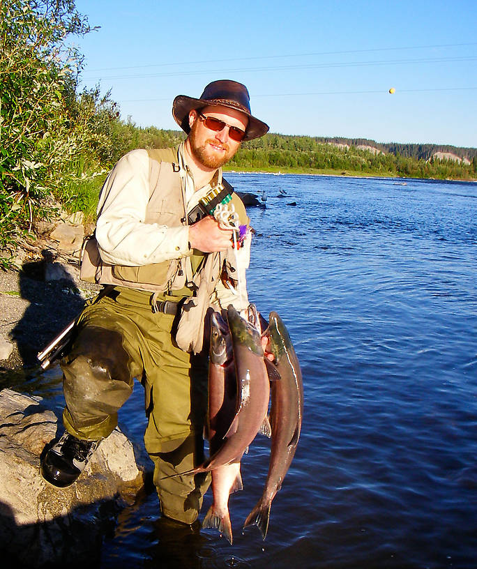 A professional photographer (whose name I forgot to get) just happened to be nearby as I finished up my sockeye fishing with this hefty limit of fresh, tasty salmon.  He took several pictures with his good camera, which hopefully he'll be sending me soon, and he snapped this one with my point+shoot camera. From the Gulkana River in Alaska.