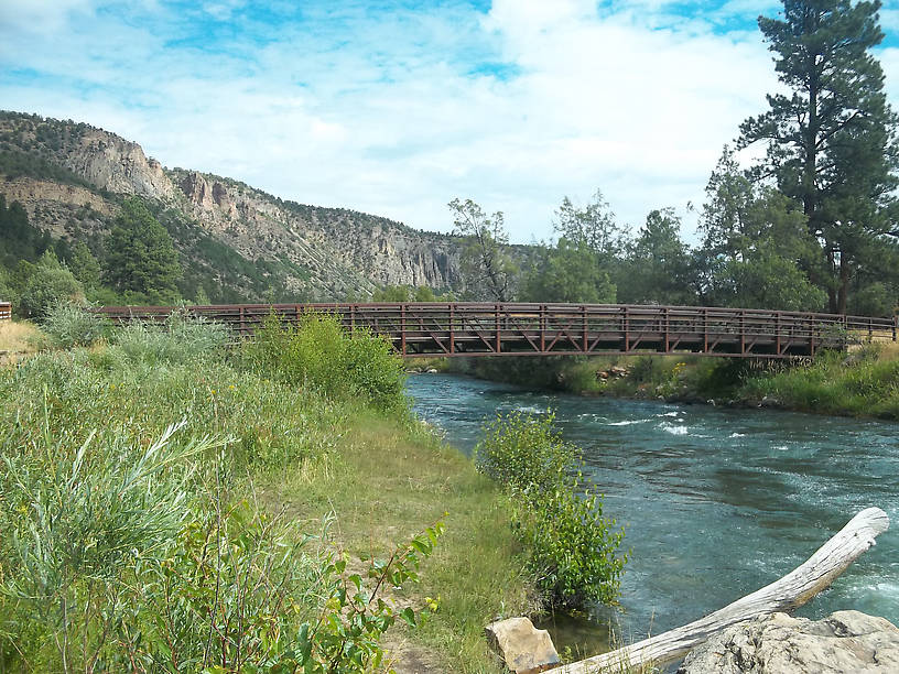 The Uncompahgre tailwaters near camp (a small footbridge allows anglers to fish both sides of the stream without attempting a difficult crossing.)