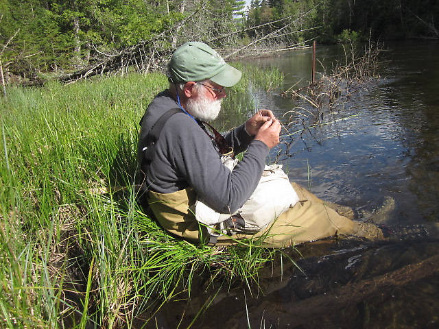 George tying on another somewhere on the Holy Water. I made him hike a mile to get to this "secret spot", threatened to have to poke out his eyes because it was such a secret, only to see us catch nothing of size there. :) I guess I'm safe. ;)