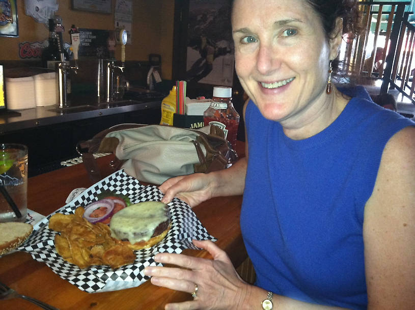 Lisa and her Bison Burger in Red Lodge Montana