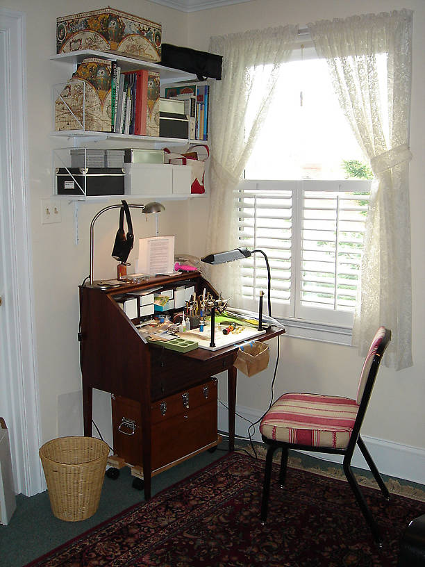 my grandmother's childhood desk, now mine, a Gerstner chest from my Best Fishing Buddy three years ago, some shelves and imagination, all in a sunny corner