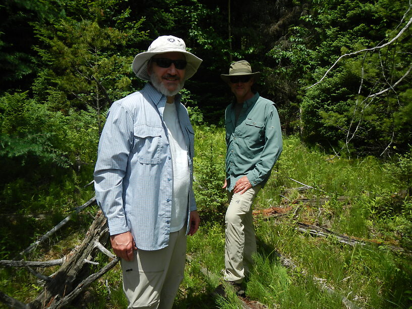 The boys in the canyon against a lush backdrop of green