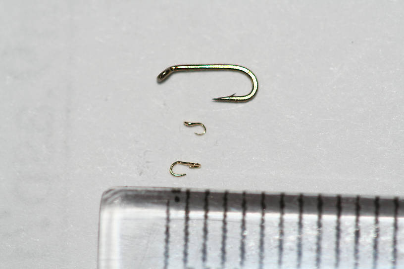 My 3rd and 4th attempts, after having made a pair of tweezers specifically for this purpose.  The larger hook is 1.75 mm long, and the smaller one is 1.30 mm long.